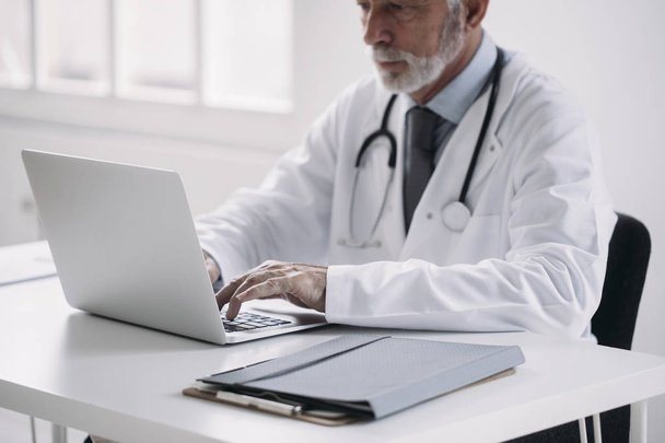 A Doctor Typing on Laptop - Fotoğraf, Görsel