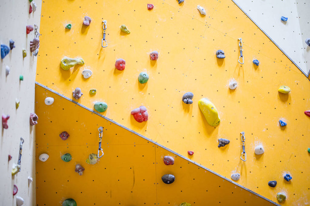 Climbing Wall. Climbing wall with colorful rocks - Foto, Bild