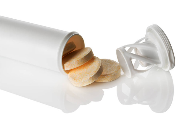Таблетки, витамины в пластиковой трубке
 - Фото, изображение