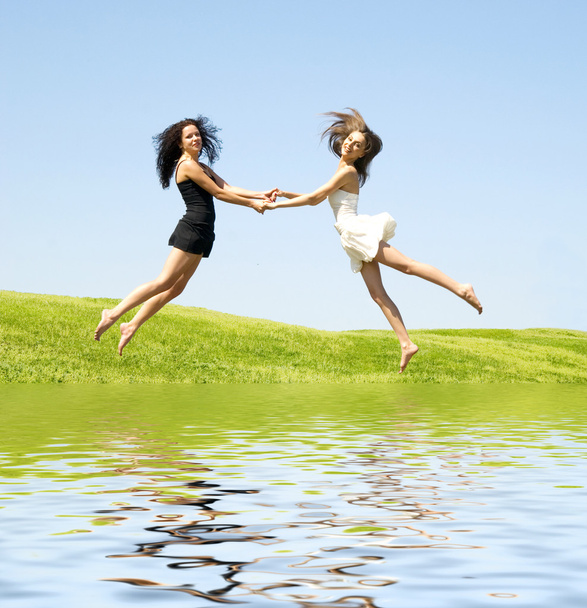 Two jumping woman - Photo, Image