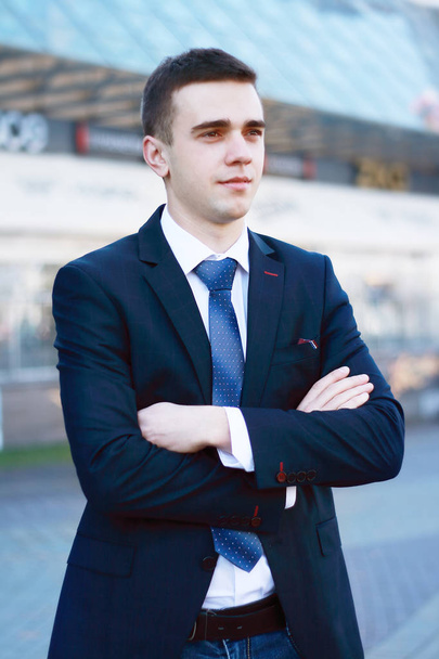 confident young businessman on background of office - Foto, Imagem