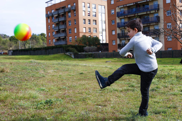 Boy kicking a ball - Photo, Image