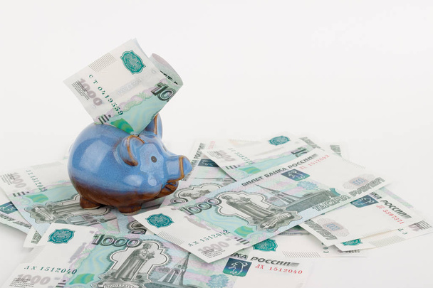 Russian rubles and piggy bank, isolated on white - Foto, Bild