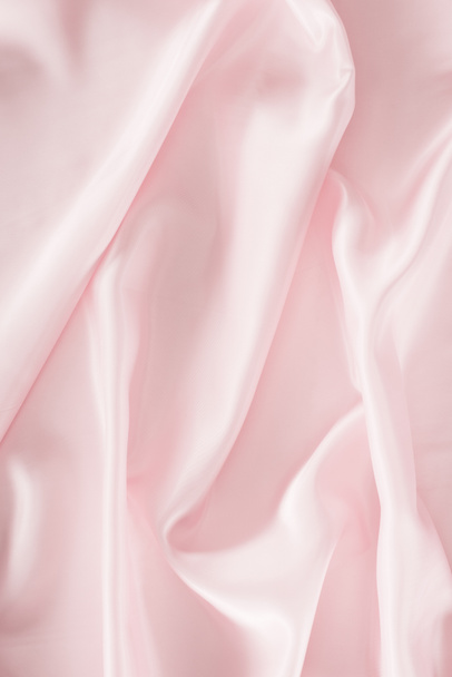 light pink shiny satin fabric background - Foto, Imagen
