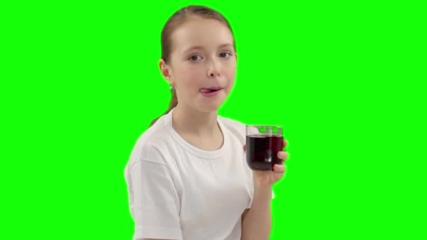 the girl drinks cherry juice - Materiał filmowy, wideo