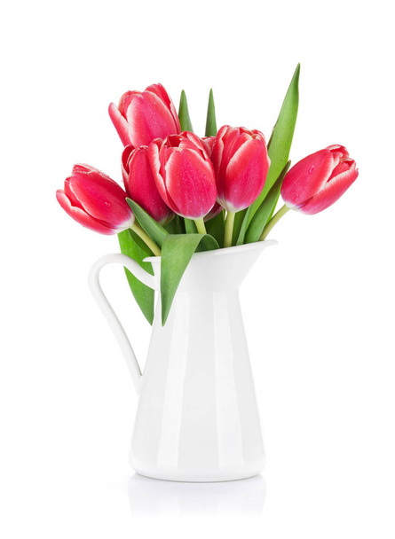 Red tulips bouquet in pitcher isolated on white background - Фото, изображение