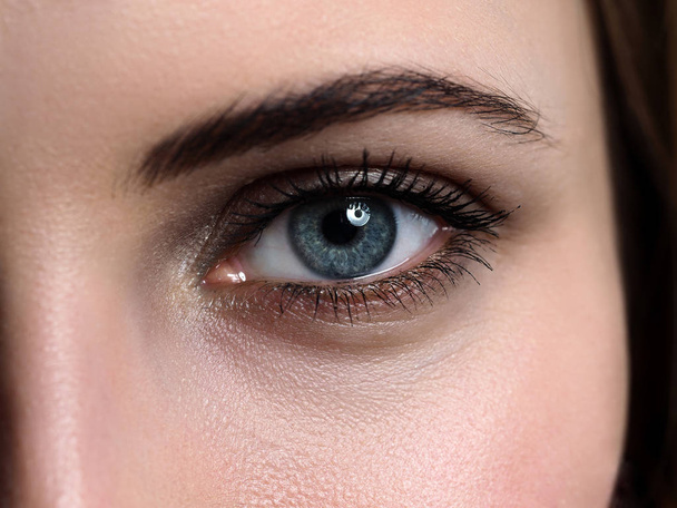 Female left green coloured eye extreme closeup - Φωτογραφία, εικόνα