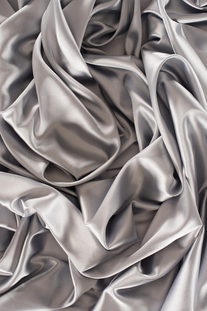 silver crumpled soft silk fabric background - Photo, Image