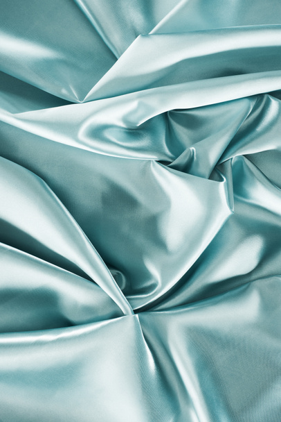 light turquoise crumpled shiny satin fabric background - Photo, Image
