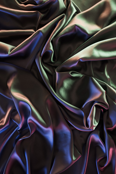 dark colored shiny silk fabric background - Valokuva, kuva