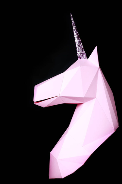 Pink unicorn on a black background. 3d model of a unicorn. Copy space - Fotó, kép