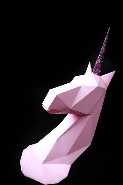 Pink unicorn on a black background. 3d model of a unicorn. Copy space - Foto, imagen