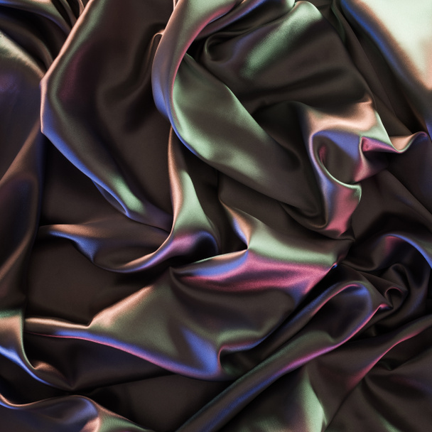 colored beautiful shiny silk fabric background - Fotó, kép
