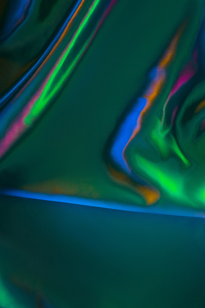 blue and green shiny satin fabric background  - 写真・画像