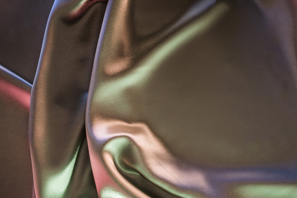 green and violet shiny silk fabric background - Photo, Image