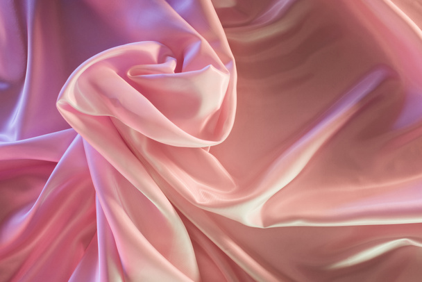 beige and pink shiny silk fabric background - Foto, afbeelding