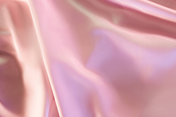 beige and pink shiny silky fabric background - Foto, afbeelding