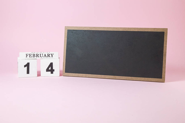 Wooden calendar and chalkboard with empty space for text on the  - Fotó, kép
