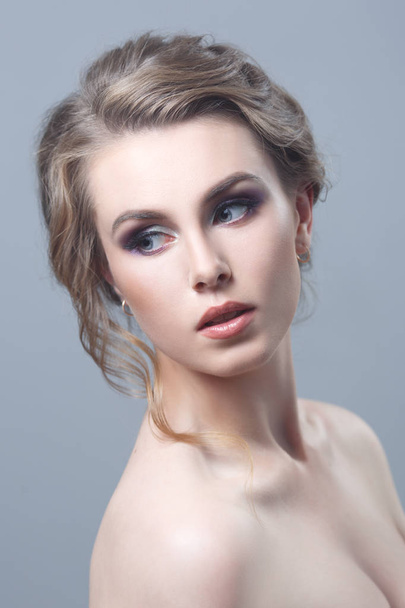 portrait of young woman with fashionable makeup on grey background - Fotografie, Obrázek