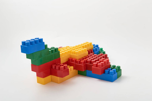 figures from a colored cubes designer on a white background - Photo, Image