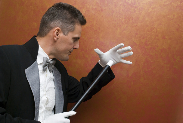 Magician performing with wand - Photo, Image