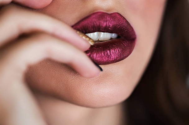Close up of beautiful woman lips with lipstick. Open mouth. Cosmetology, fashion makeup concept. Beauty studio shot. - Fotoğraf, Görsel