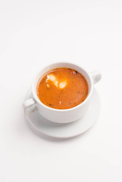 Appetizing tomato soup served in white bowl - Fotó, kép