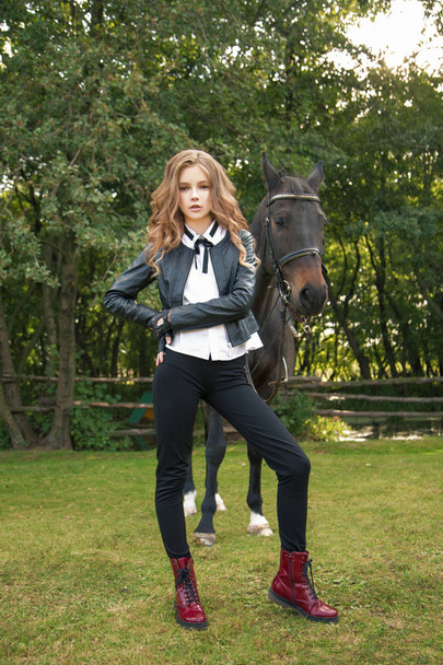 girl teenager with a horse - 写真・画像