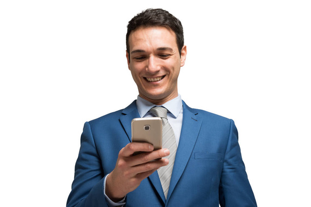 Businessman using his phone isolated on white background  - Foto, Imagem