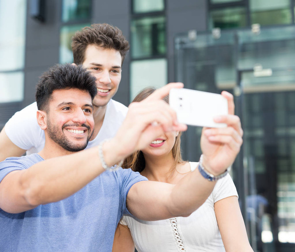 Group of friends taking a selfie - Фото, изображение