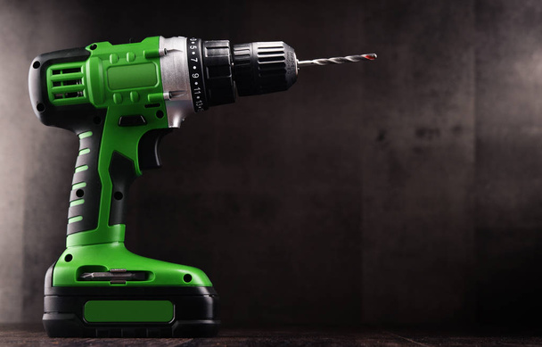 Cordless drill with drill bit working also as screw gun - Photo, Image