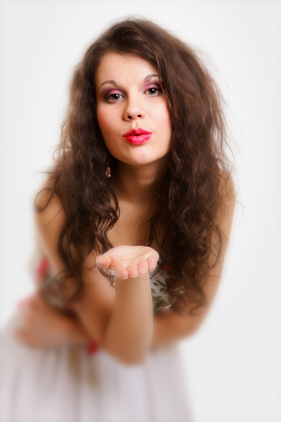 Young woman blowing a kiss isolated - Foto, Imagen