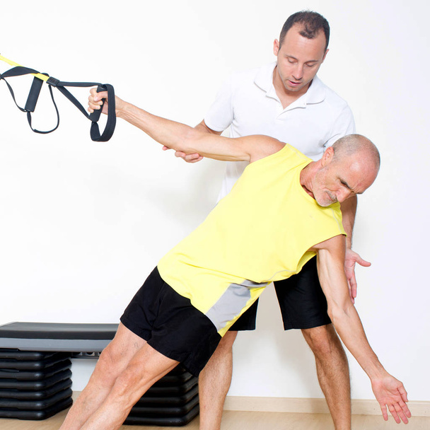 Suspension training with coach - Photo, Image