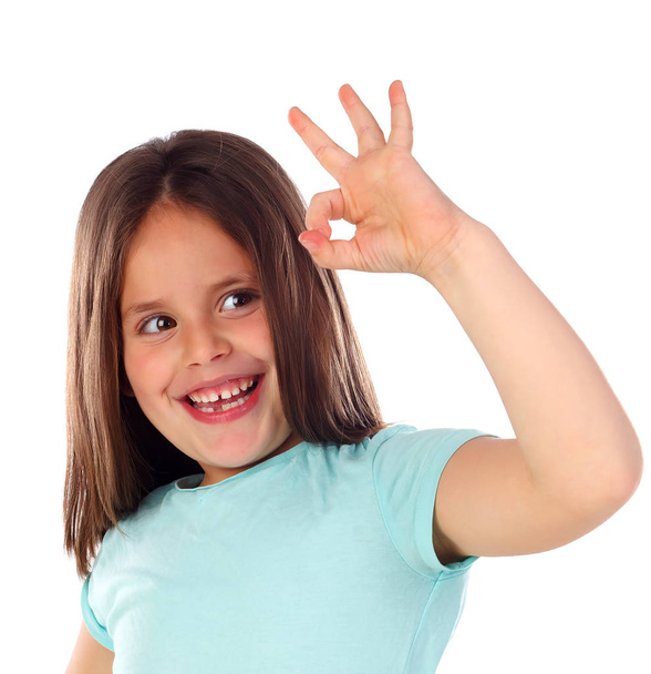 happy little girl showing ok gesture isolated on white background - Foto, imagen