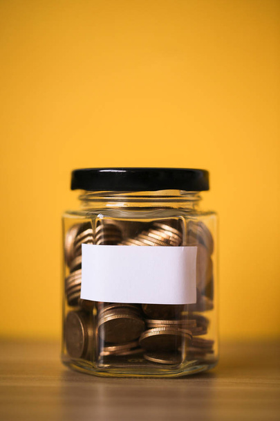 Coins In Glass Money Jar - Foto, immagini