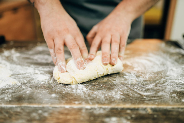 fresh pasta cooking, chef hands with dough - Foto, imagen