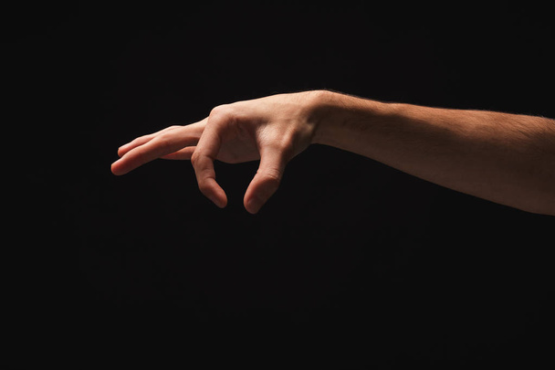 Męskiej ręki podniesienie coś, wyłącznik, w czarne - Zdjęcie, obraz