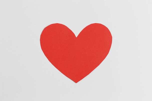 Red paper of heart shape isolated on white background. - 写真・画像