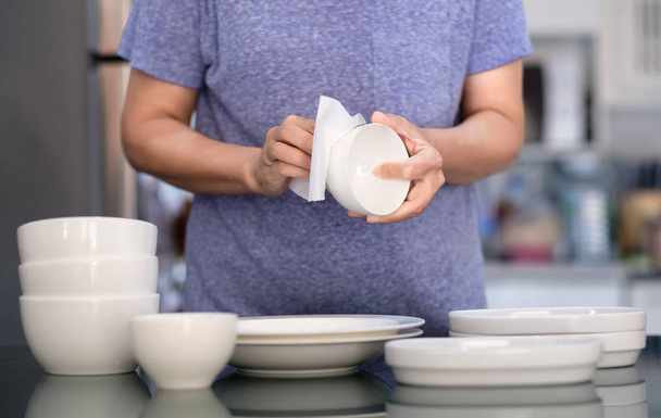 Woman Cleaning product concept wiping dishware cleaner in home a - Φωτογραφία, εικόνα