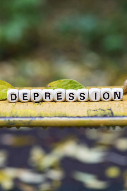 Слово DEPRESSION складається з дерев'яних літер
. - Фото, зображення