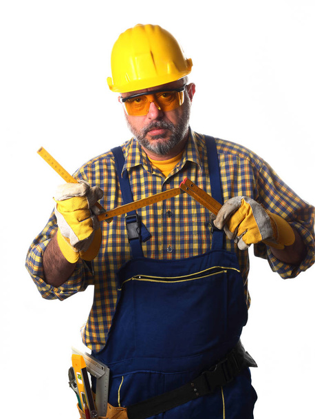 trabajador con vara de medir
 - Foto, Imagen