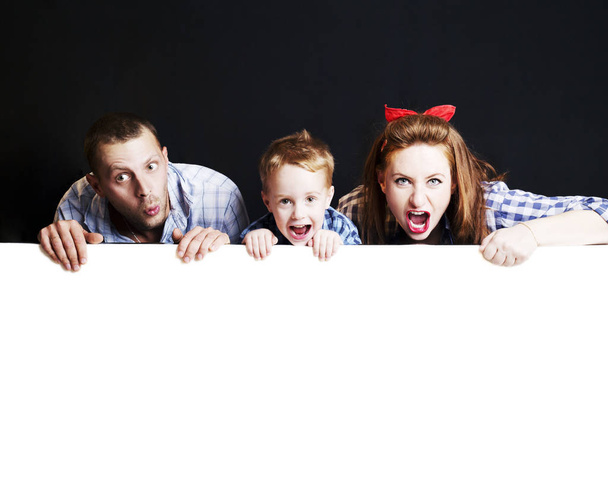 happy family in the studio on a black and white background - Fotografie, Obrázek