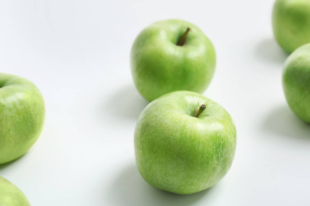 Fresh green apples on white background - 写真・画像