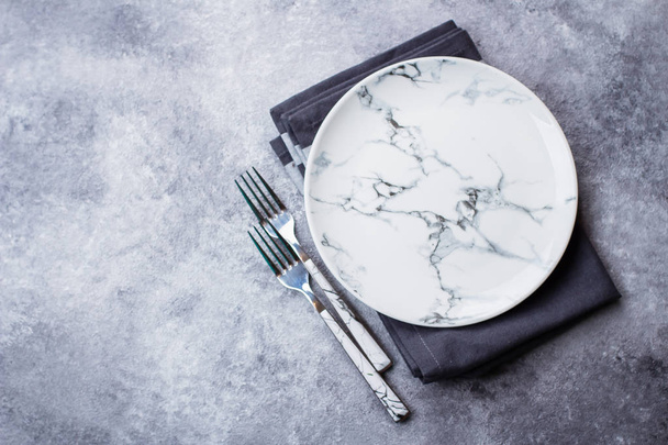 Empty ceramic marble plate on gray stone concrete table background. Copy space. Menu Recipe Concept - Photo, Image