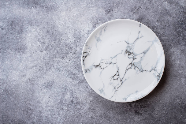 Empty ceramic marble plate on gray stone concrete table background. Copy space. Menu Recipe Concept - Fotografie, Obrázek