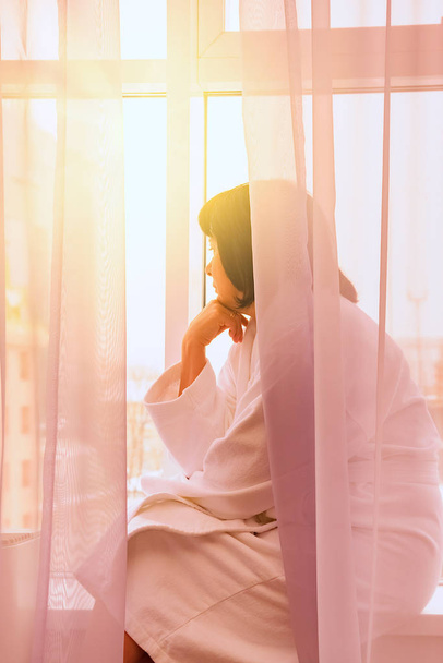 woman by the window sunlight - Foto, Imagem