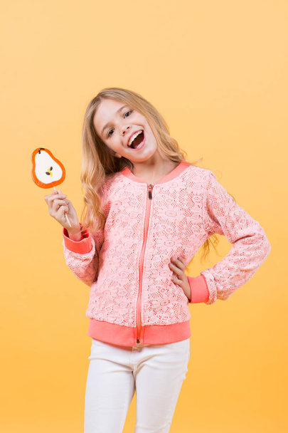 Happy smiling child with sweet lollipop - Fotó, kép