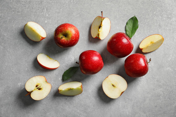 Fresh ripe red apples on light grey background - Фото, изображение