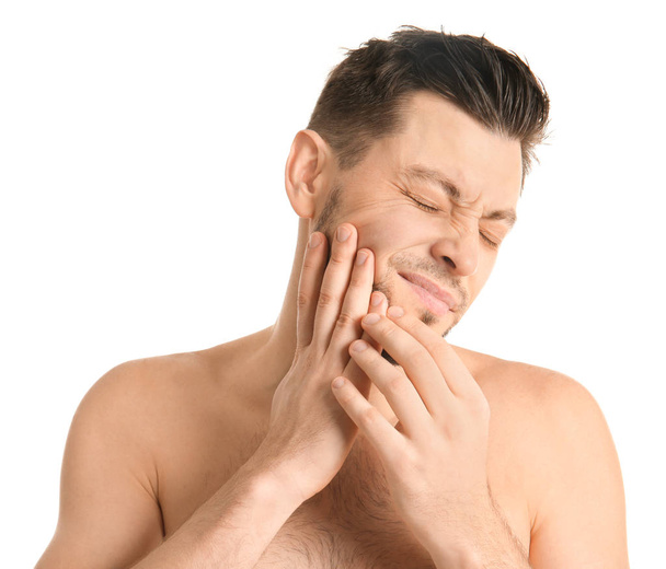Young man suffering from toothache on white background - Foto, Imagem