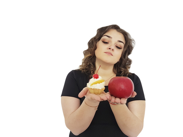 ragazza piena con una torta e una mela isolata
 - Foto, immagini